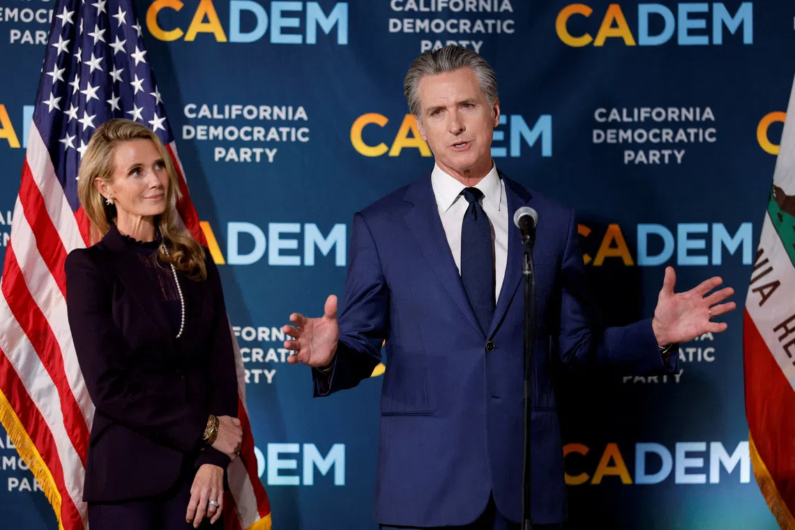 California's Governor Gavin Newsom speaks next to his wife Jennifer Siebel Newsom after California's special election on Proposition 50, a measure that would temporarily redraw congressional districts, in Sacramento, California, U.S., November 4, 2025. REUTERS/Fred Greaves