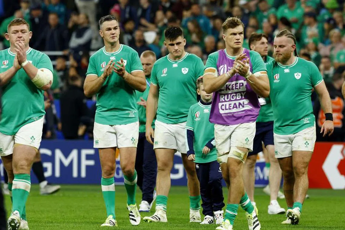 Rugby Union - Rugby World Cup 2023 - Quarter Final - Ireland v New Zealand - Stade de France, Saint-Denis, France - October 14, 2023 Ireland's Johnny Sexton, Josh van der Flier and teammates applaud the fans after the match REUTERS/Gonzalo Fuentes