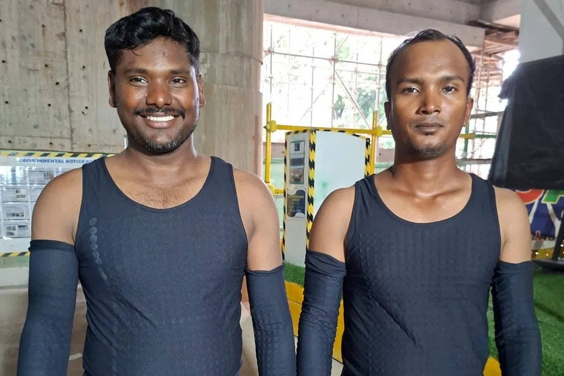 Two workers don cooling wearables