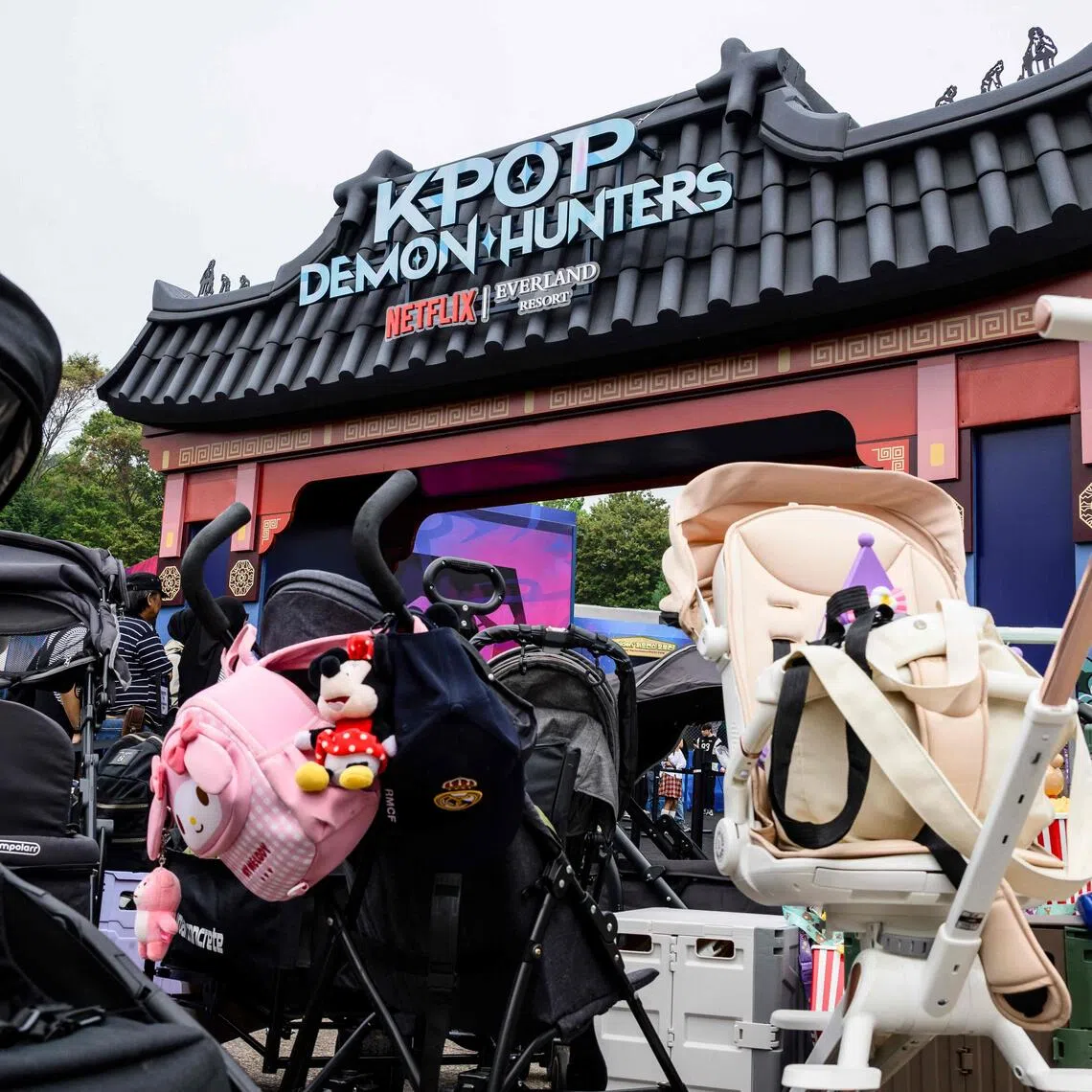 Baby strollers parked outside the entrance of a KPop Demon Hunters-themed zone at the Everland Resort in South Korea's largest theme park in Gyeonggi province. 