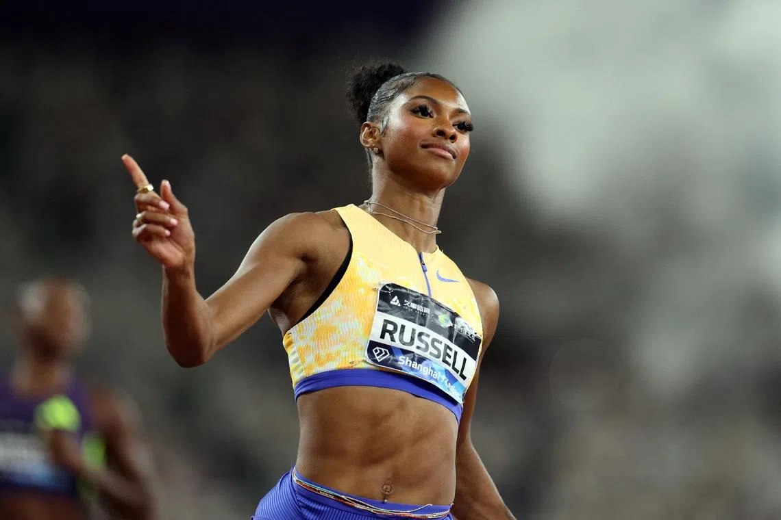 FILE PHOTO: Athletics - Diamond League - Shanghai/Keqiao - China Textile City Sports Center, Shaoxing, China - May 16, 2026 Masai Russell of the U.S. celebrates after winning the women's 100m hurdles as she breaks the meet record and becomes the new world leader REUTERS/Go Nakamura/File Photo