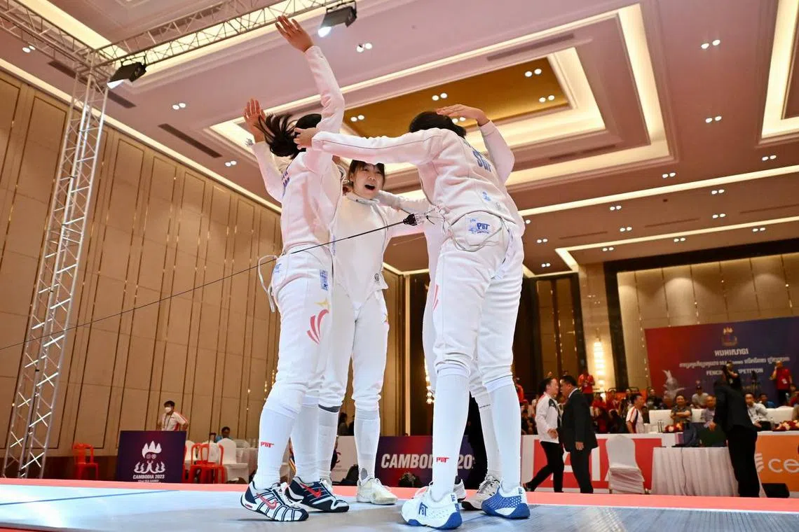 The Singapore women's epee fencing team celebrating after beating the Philippines to win the gold medal at the SEA Games on Tuesday.