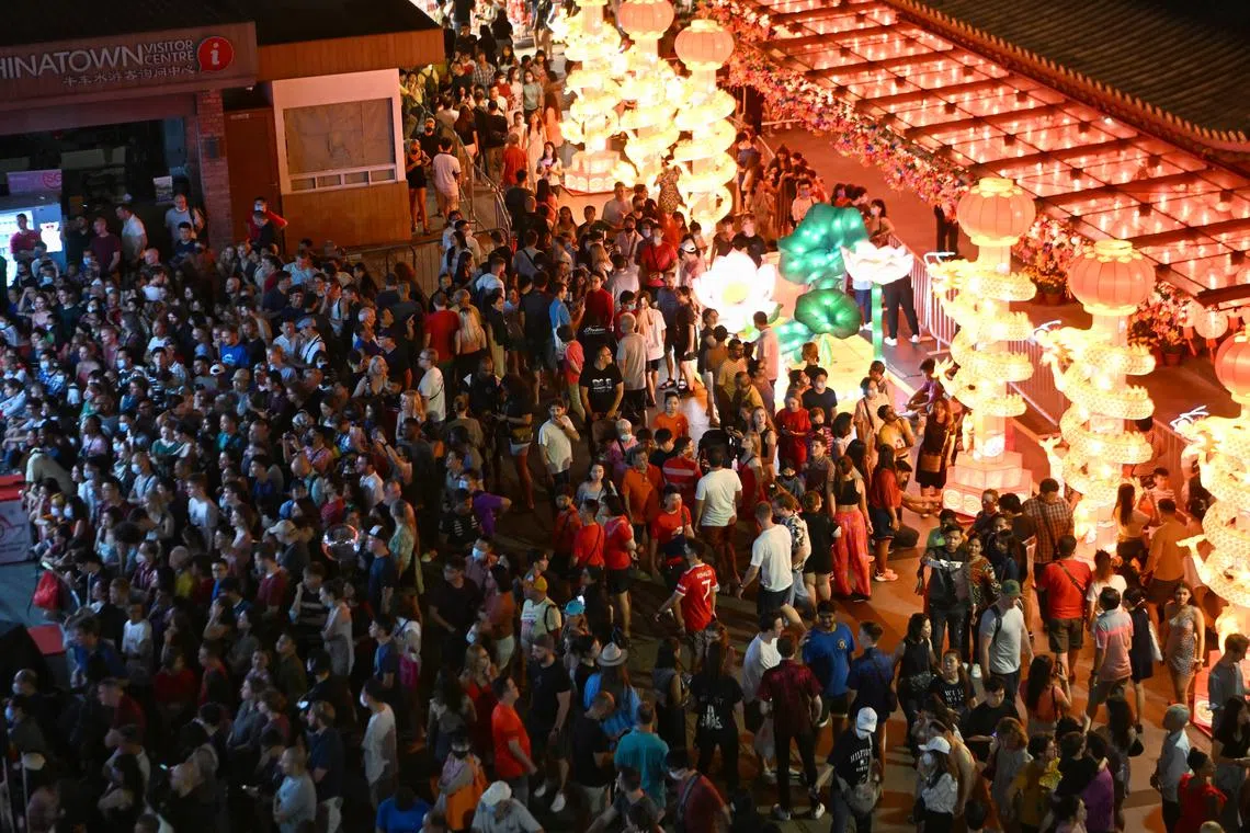 People on the street of Chinatown for Chinese New Year celebrations on the eve of the New Year on 21 January 2023.