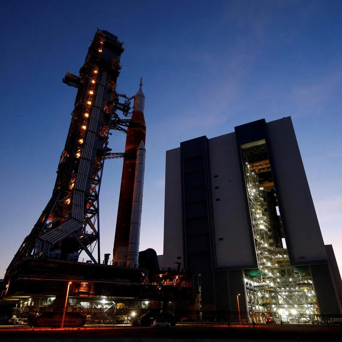 NASA's next-generation moon rocket, the Space Launch System (SLS) rocket with the Orion crew capsule, rolls from its launch pad back to the Vehicle Assembly Building for repairs ahead of the Artemis II mission launch at the Kennedy Space Center in Cape Canaveral, Florida, US Feb 25.