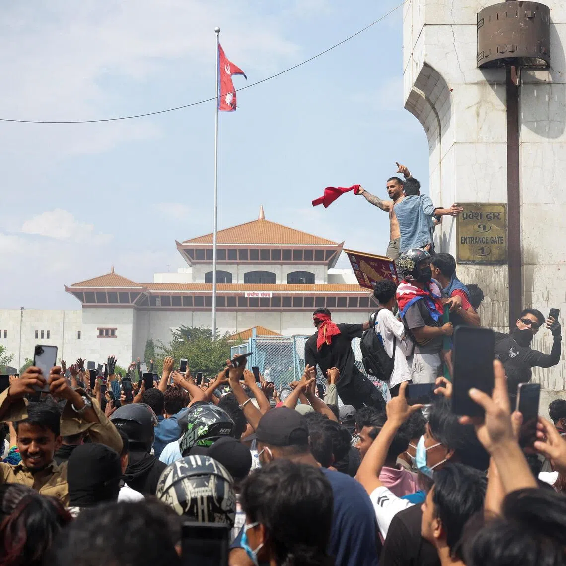 Demonstrators enter Parliament during a protest against Monday's killing of 19 people after anti-corruption protests that were triggered by a social media ban, which was later lifted, during a curfew in Kathmandu, Nepal, September 9, 2025. REUTERS/Adnan Abidi