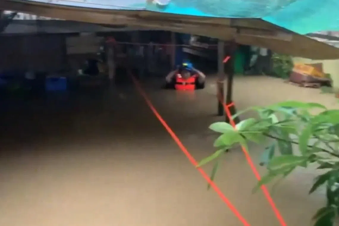 Flooding seen in the village of Quitang, in Pasacao, due to Storm Trami on Oct 22.