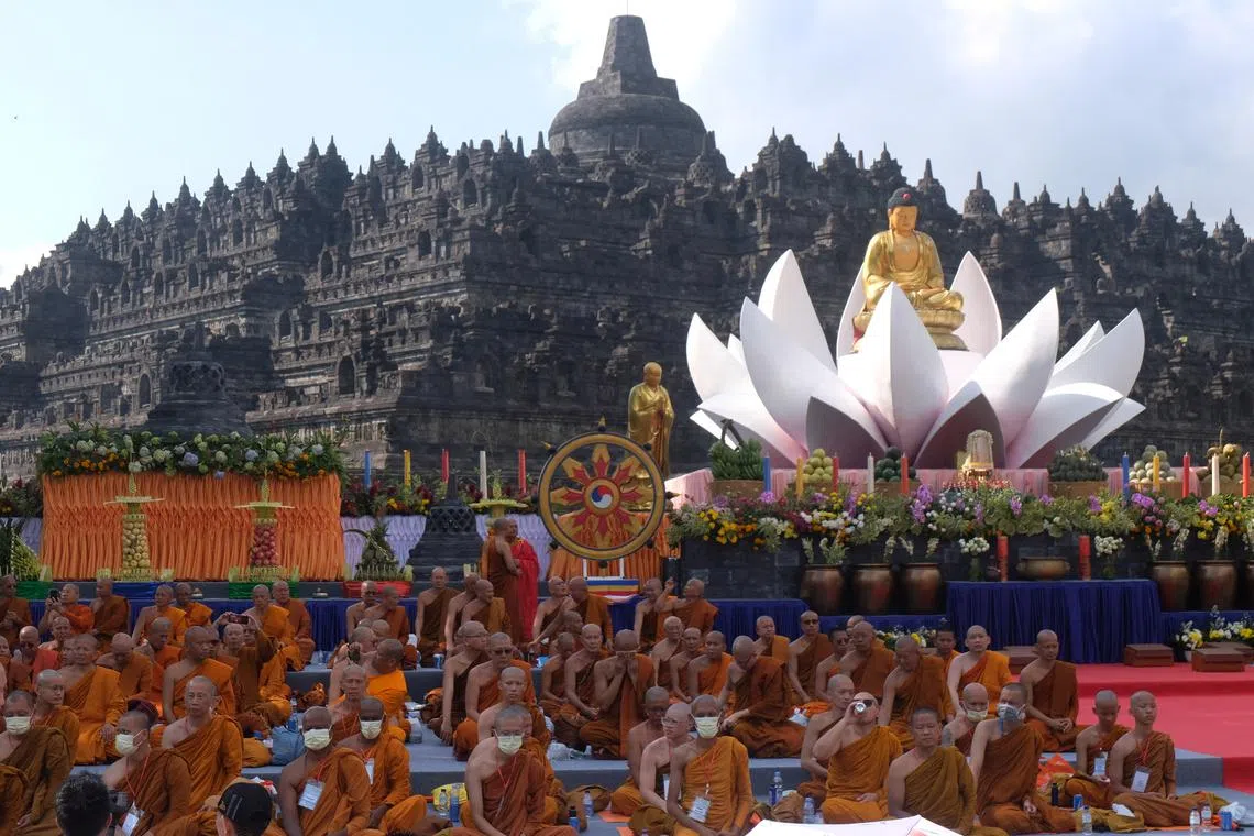 Buddhist monks take part in a ritual at the Borobudur Temple during the celebration of Vesak day in Magelang, Central Java province, Indonesia, on June 4, 2023.