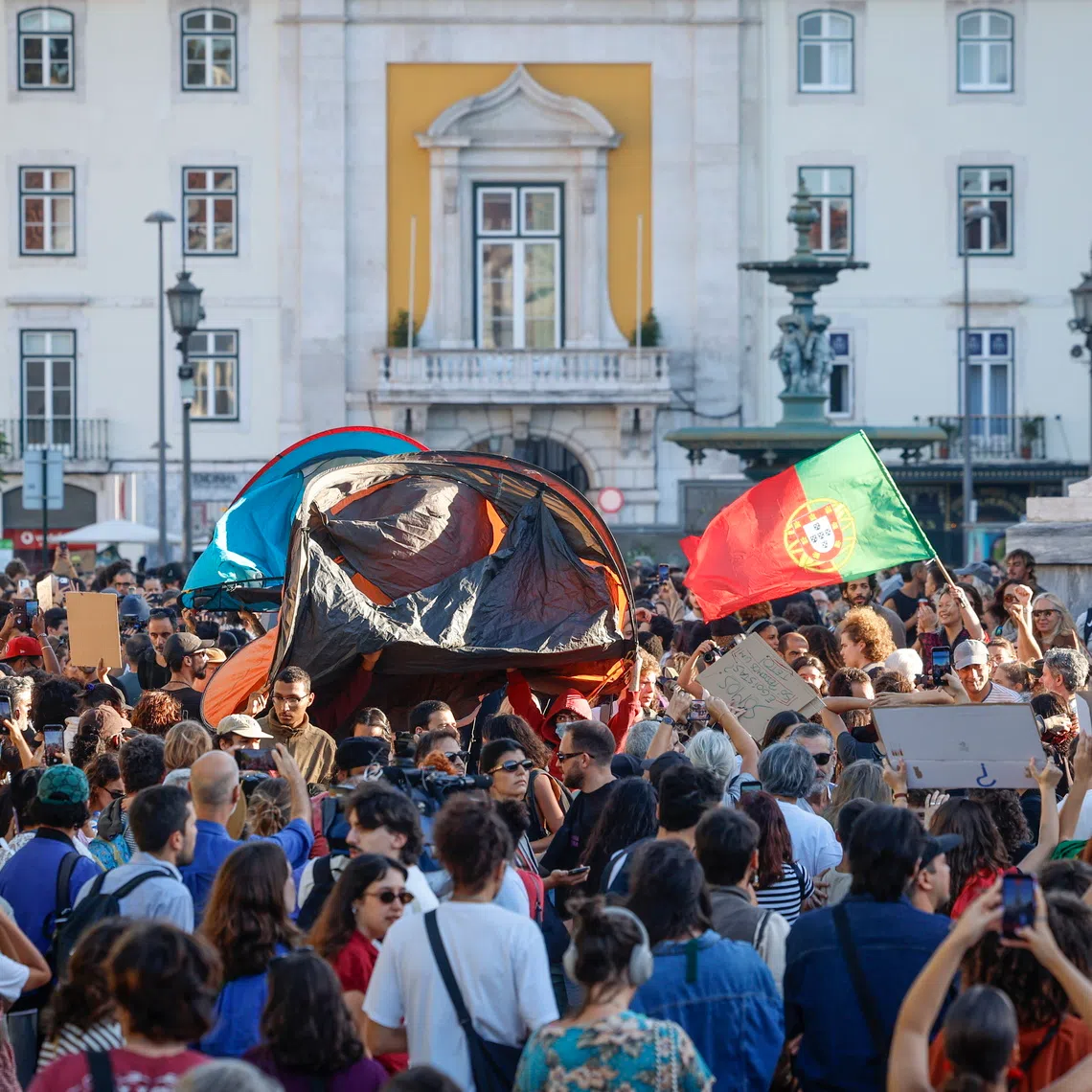Demonstrators gather at Rossio Square during a housing protest in Lisbon, Portugal, on Oct 17.