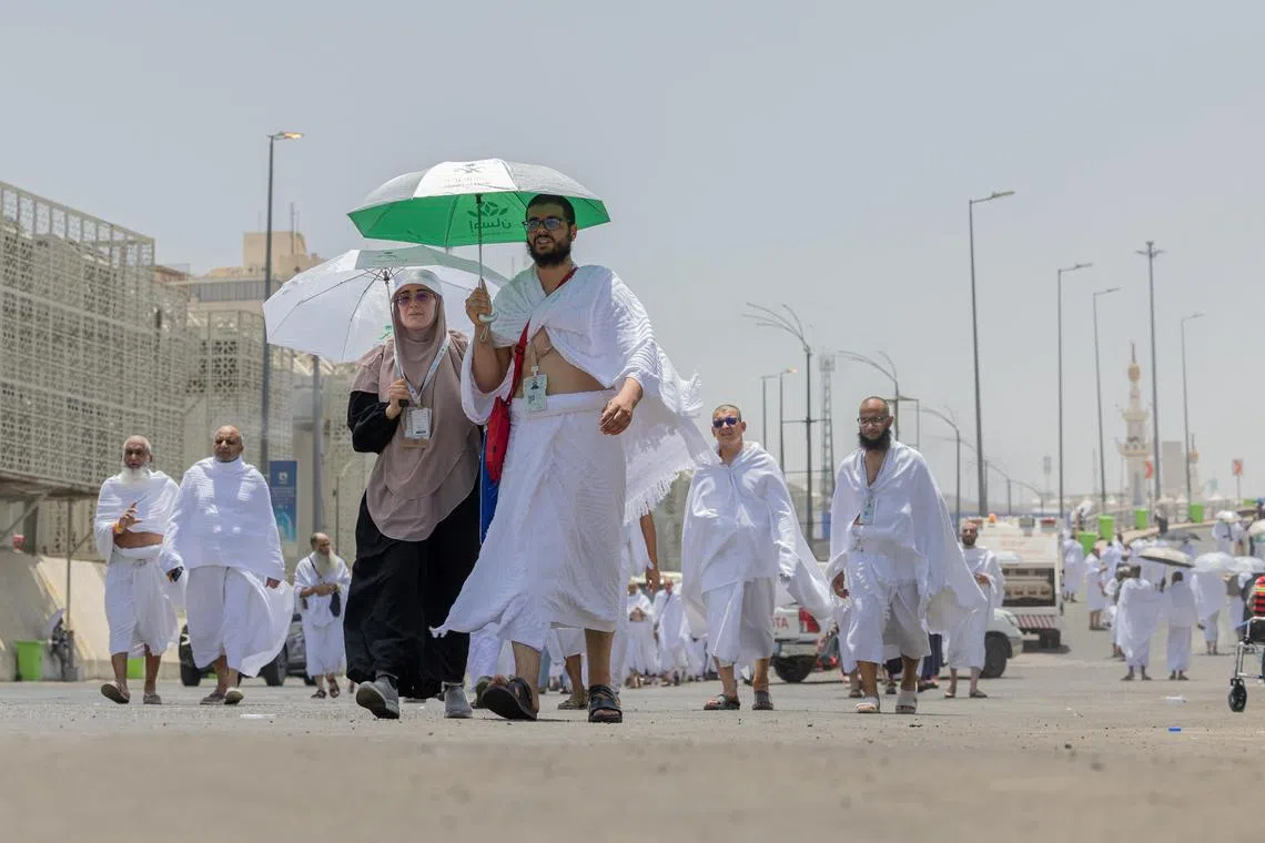 Muslims making their way to Mina during the haj pilgrimage from the holy city of Mecca on June 4.