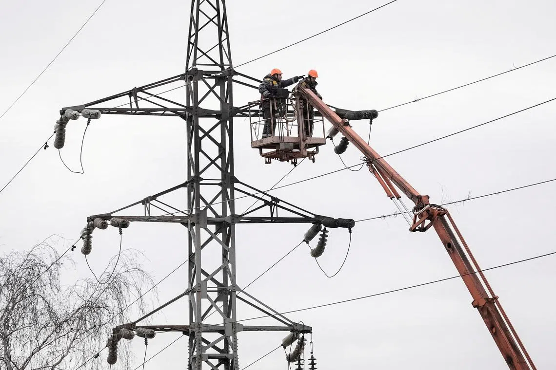 FILE PHOTO: Energy supply workers restore a high-voltage line destroyed in Russian missile attack, amid Russia's attack on Ukraine, in Kyiv, Ukraine February 7, 2024. REUTERS/Anna Voitenko/File Photo