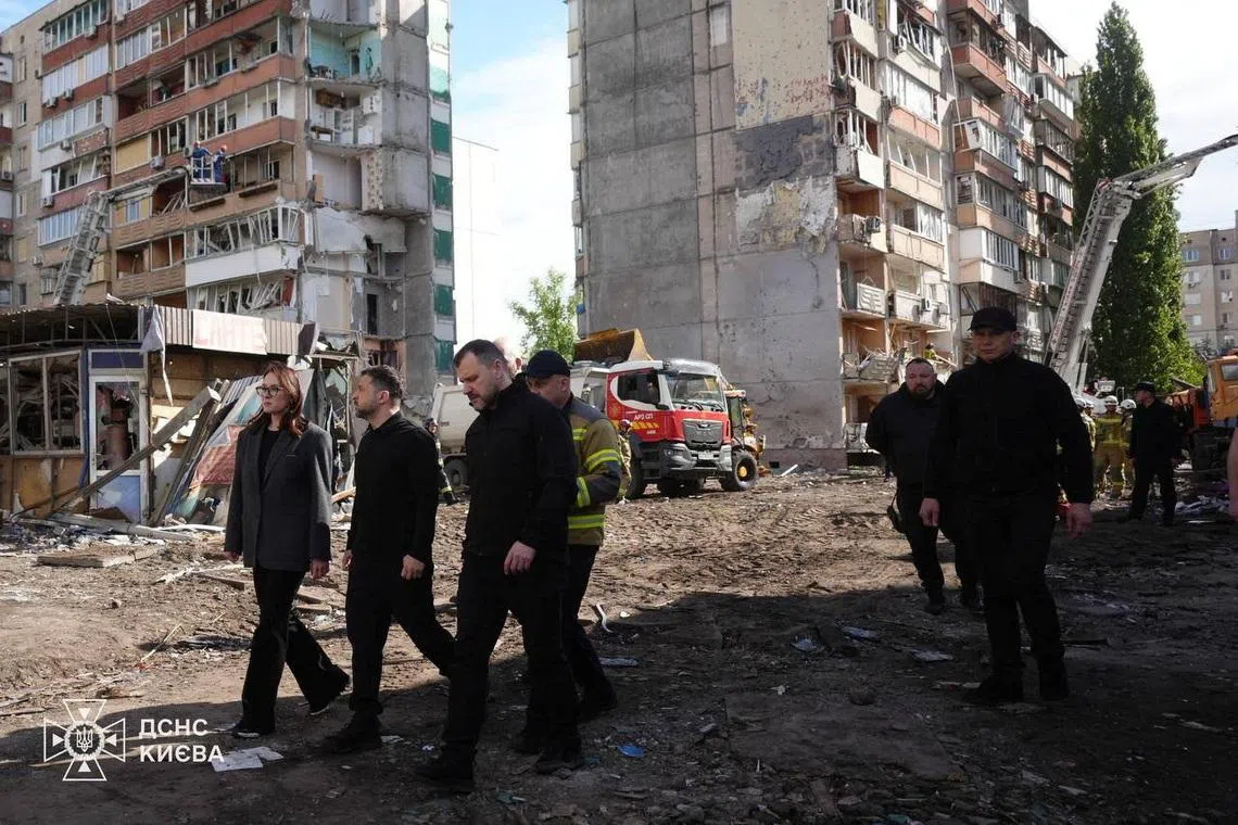 Ukraine's President Volodymyr Zelenskiy, Ukrainian Prime Minister Yulia Svyrydenko and Ukrainian Minister of Internal Affairs Ihor Klymenko visit the site of an apartment building damaged during yesterday's Russian missile and drone strike, amid Russia's attack on Ukraine, in Kyiv, Ukraine in this handout picture released May 15, 2026. Press service of the State Emergency Service of Ukraine in Kyiv/Handout via REUTERS ATTENTION EDITORS - THIS IMAGE HAS BEEN SUPPLIED BY A THIRD PARTY. WATERMARK FROM SOURCE. MANDATORY CREDIT. BEST QUALITY AVAILABLE.
