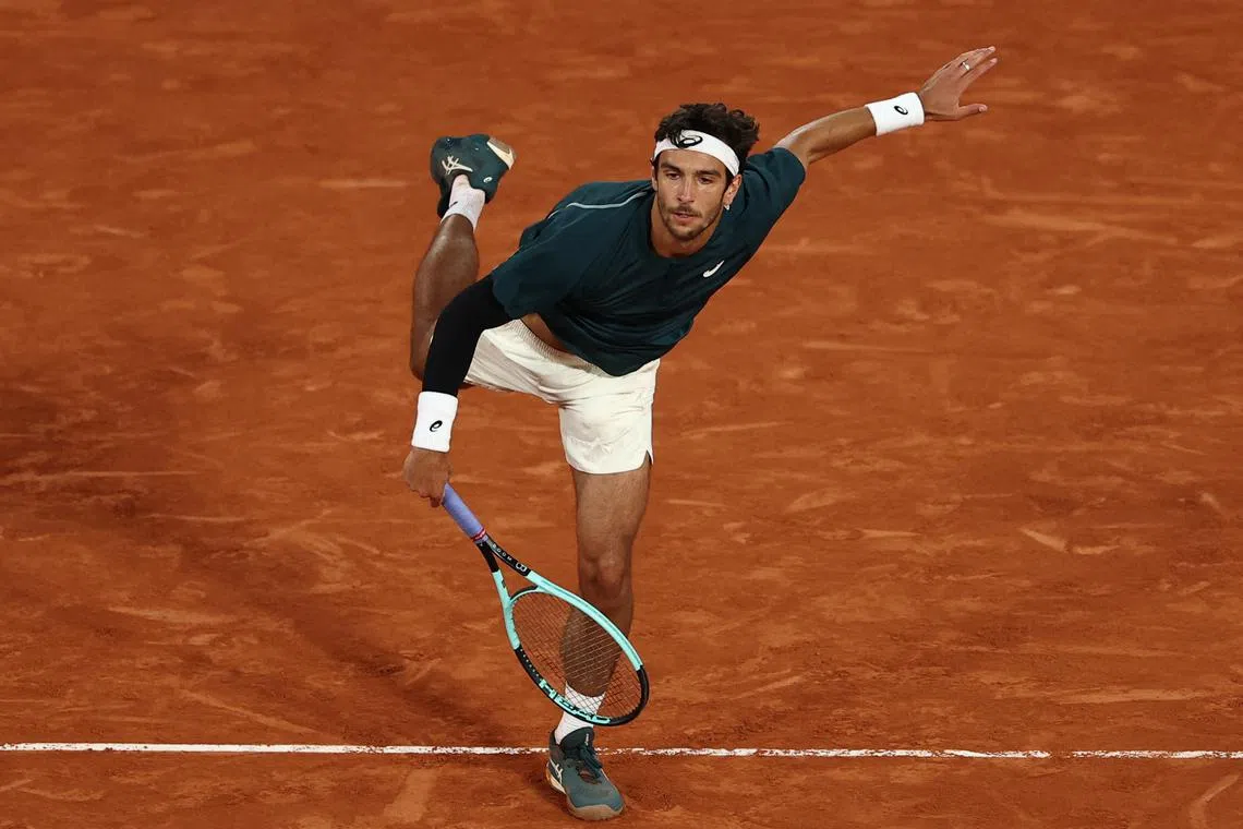 Tennis - French Open - Roland Garros, Paris, France - June 1, 2025 Italy's Lorenzo Musetti in action during his fourth round match against Denmark's Holger Rune REUTERS/Gonzalo Fuentes