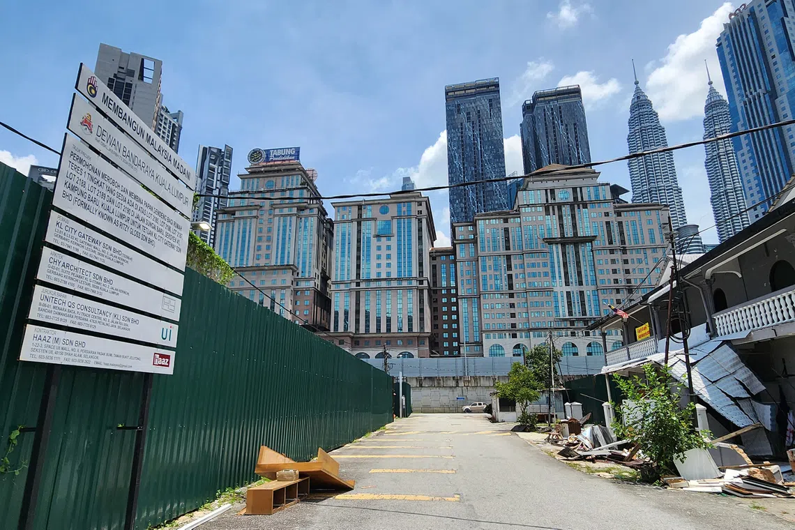Kampung Sungai Baru, a stone's throw from Kuala Lumpur's iconic Petronas Twin Towers, is at the centre of a redevelopment dispute.