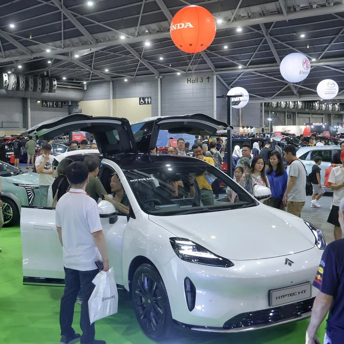 Visitors viewing the Aion Hyptec HT at the Car Expo on Oct 5.
