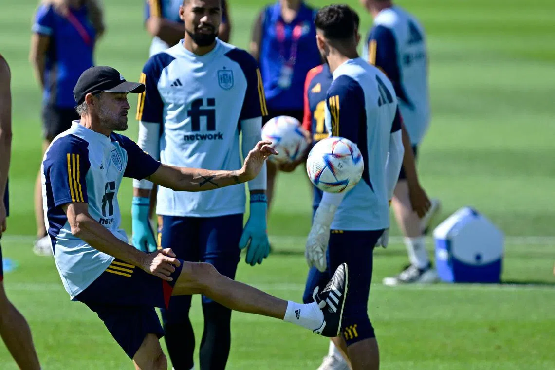 Spain coach Luis Enrique conducting a training session at the University of Qatar in Doha on Nov 24.