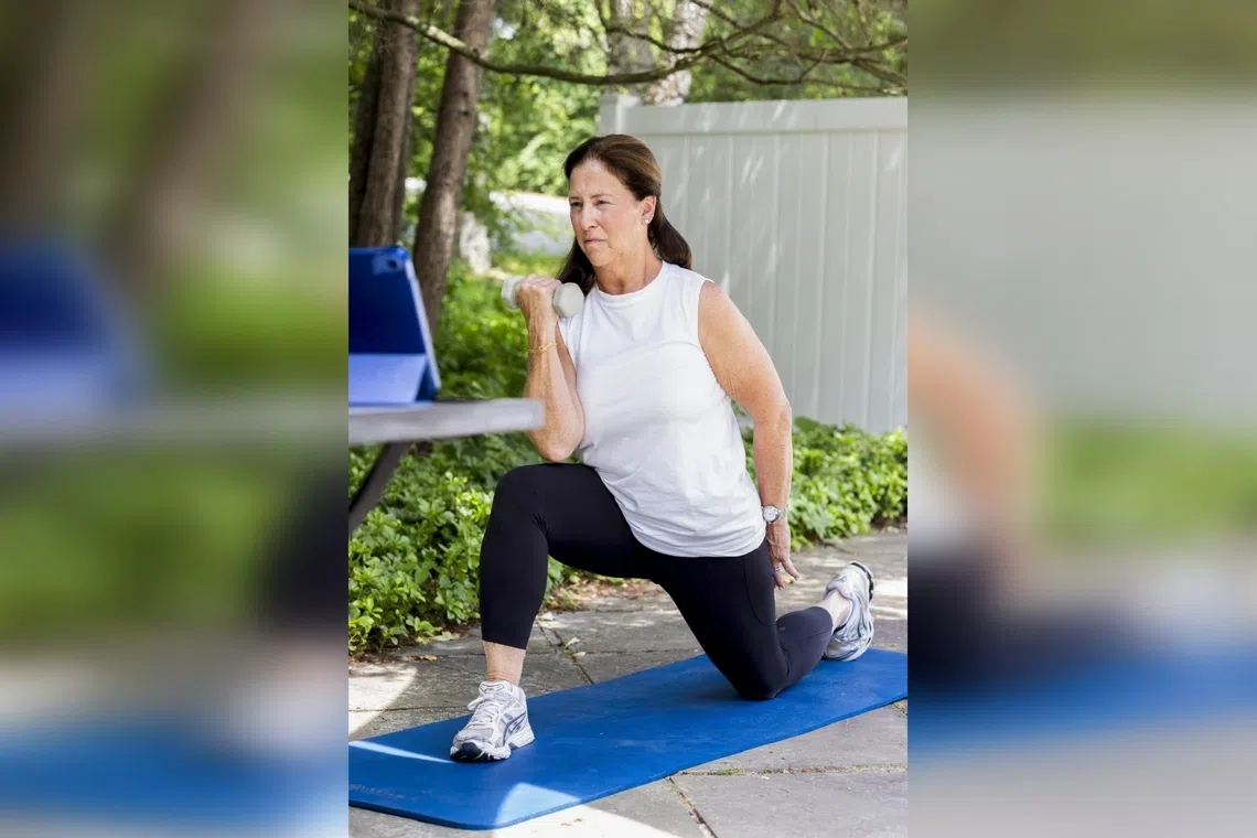 Liz Birenbaum, 60, works out at her home in Chappaqua, New York, on June 5.