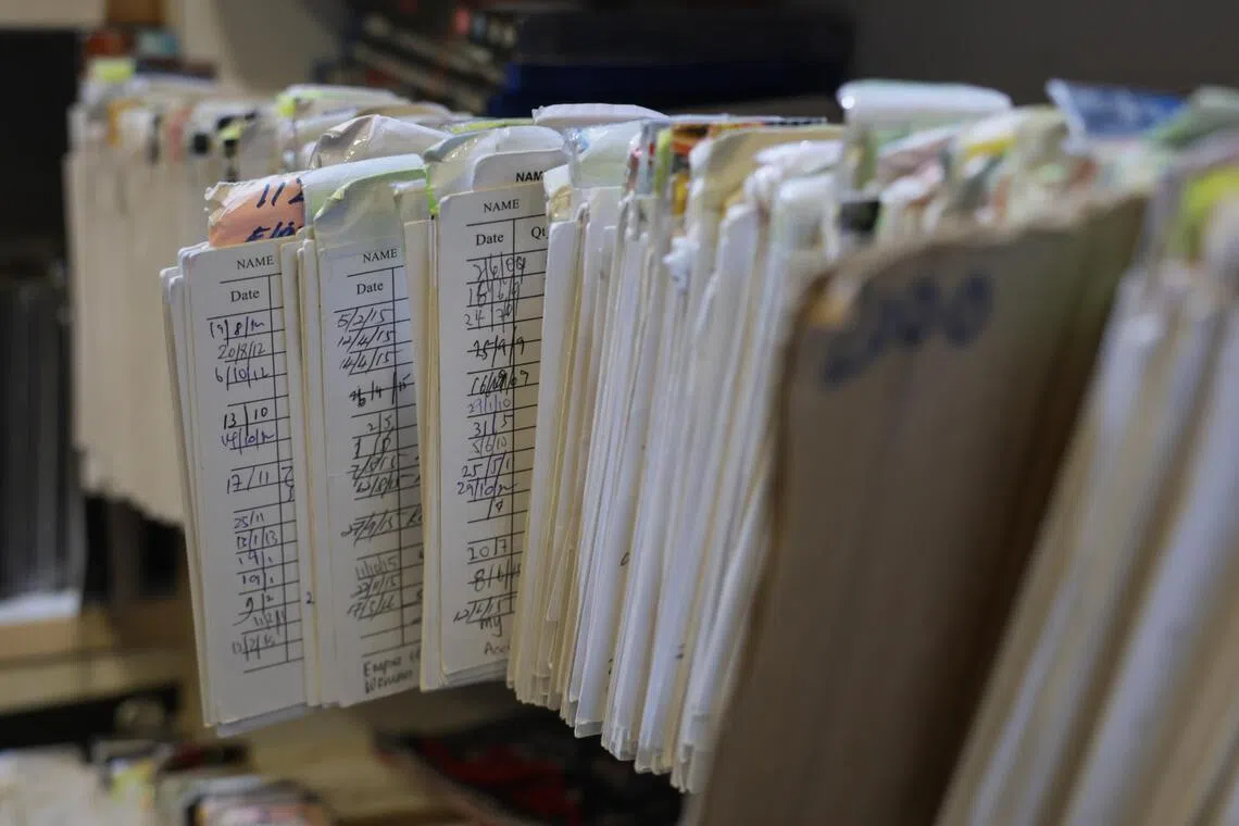 Handwritten video rental cards used to track DVD or video borrowing at Rida Video Centre. The manual card system records a customer’s name and borrowing date.