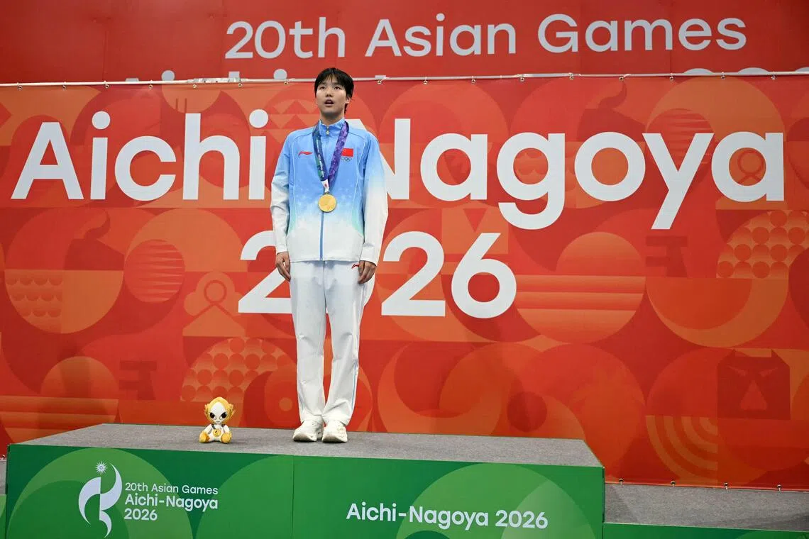 China’s Yu Zidi poses on the podium during the victory ceremony of the Asian Games women’s 400m individual medley at the Tokyo Aquatics Centre in Tokyo on Sept 23.