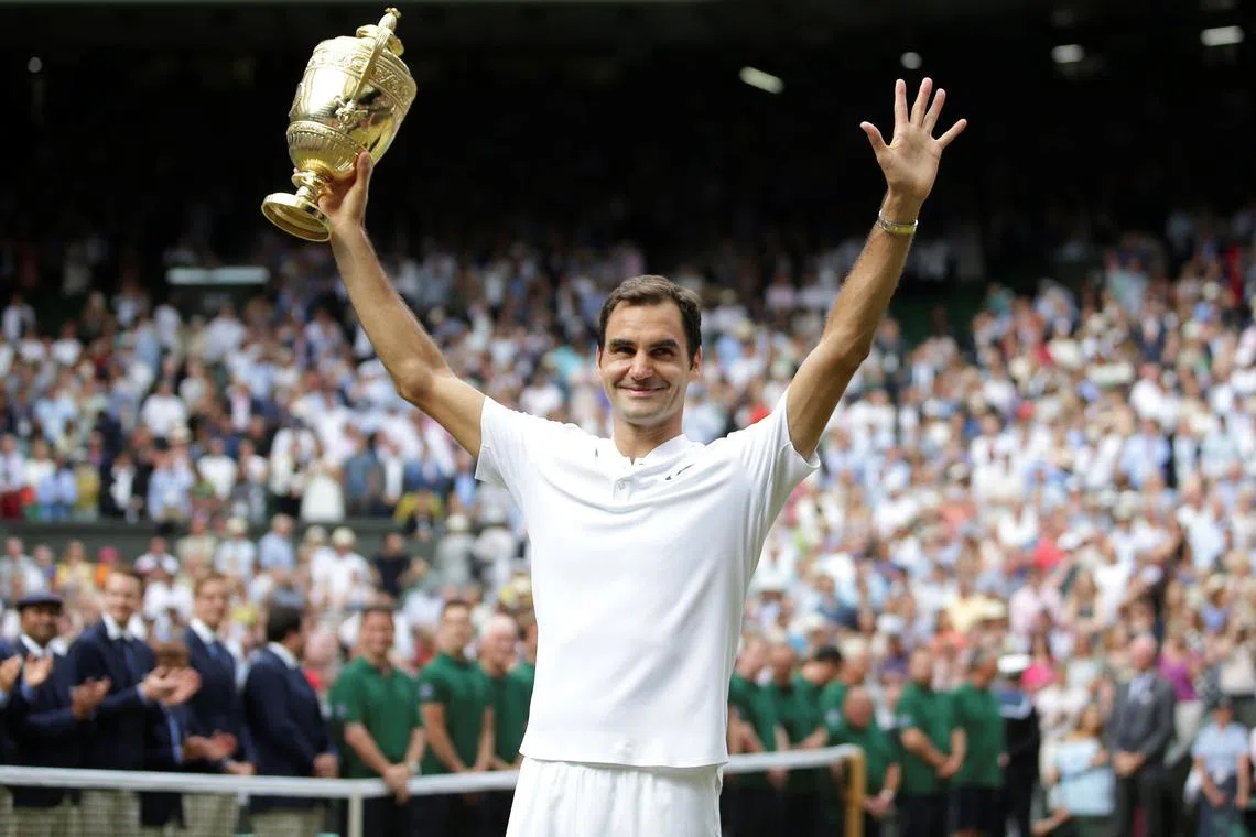 FILE PHOTO: Tennis - Wimbledon - London, Britain - July 16, 2017   Switzerland’s Roger Federer poses with the trophy as he celebrates winning the final against Croatia’s Marin Cilic    REUTERS/Daniel Leal-Olivas/Pool/File Photo