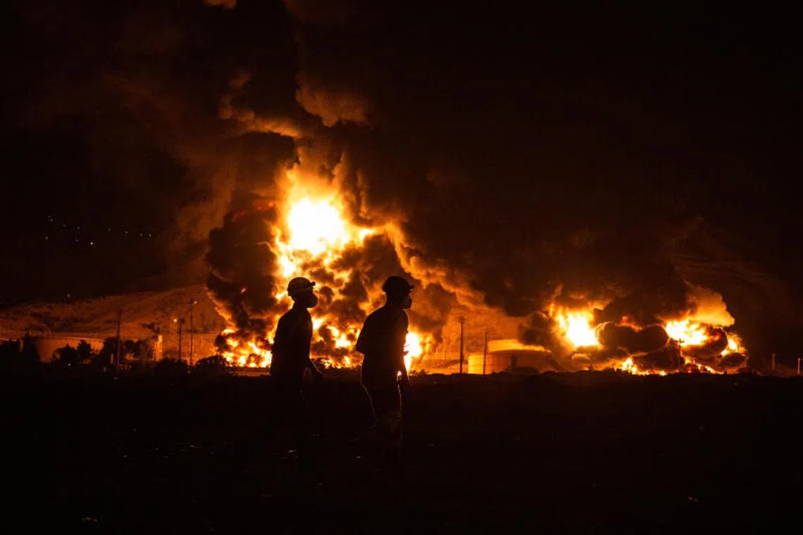 An oil storage facility burns after being hit by Israeli airstrikes in Tehran, Iran, on June 15.