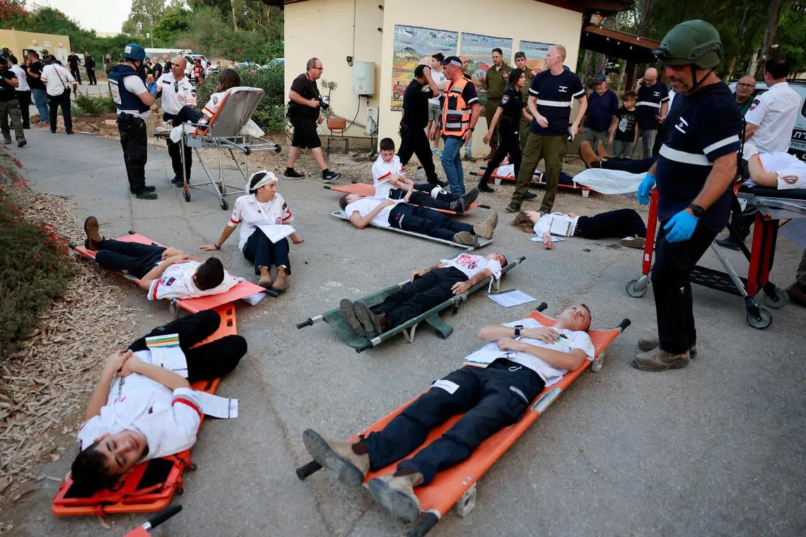 Members of Magen David Adom ambulance services conduct a drill for handling war situations, including a blackout scenario and mass casualty event, amid heightened cross-border hostilities between Hezbollah and Israeli forces, in Kibbutz Afek in northern Israel, July 31, 2024. REUTERS/Ammar Awad
 