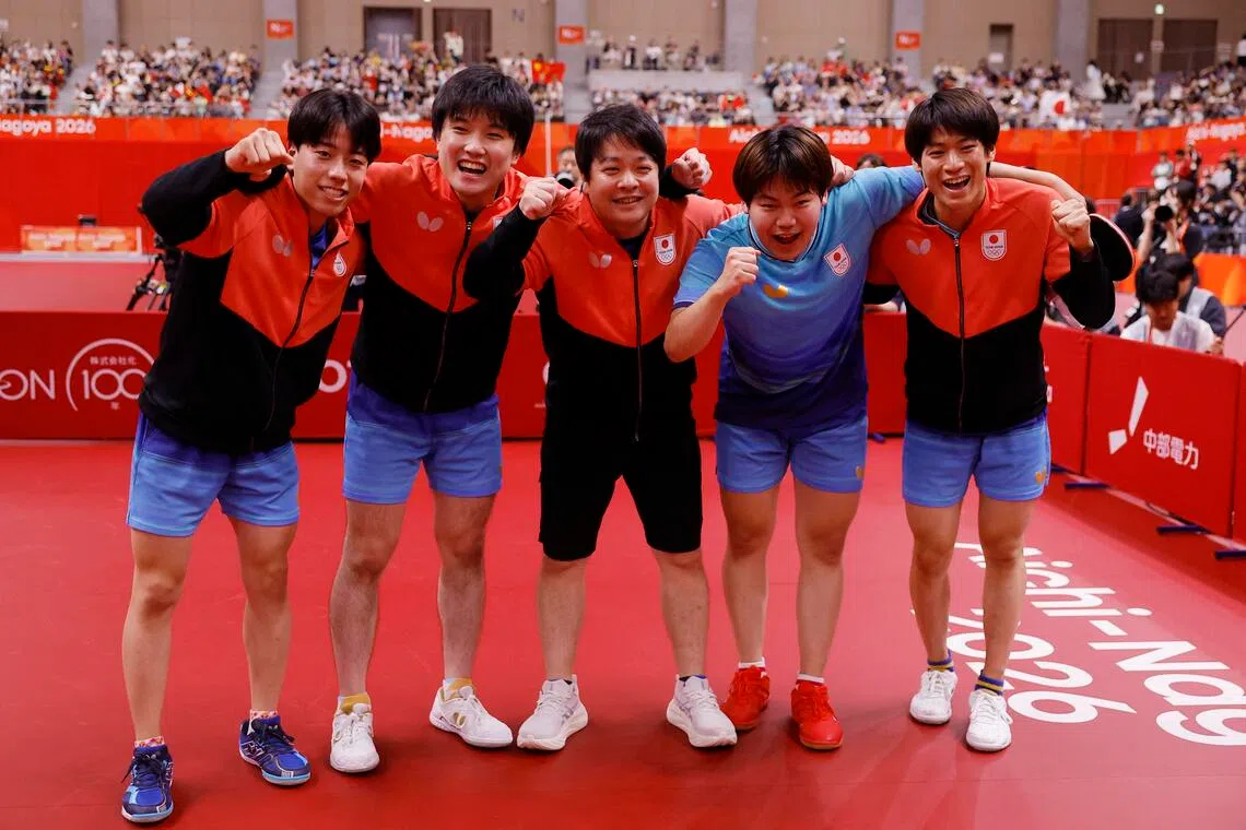 Japan’s Tomokazu Harimoto, Sora Matsushima, Shunsuke Togami, Hiroto Shinozuka and coach Seiya Kishikawa celebrate after winning the Asian Games table tennis men’s team final on Sept 24.