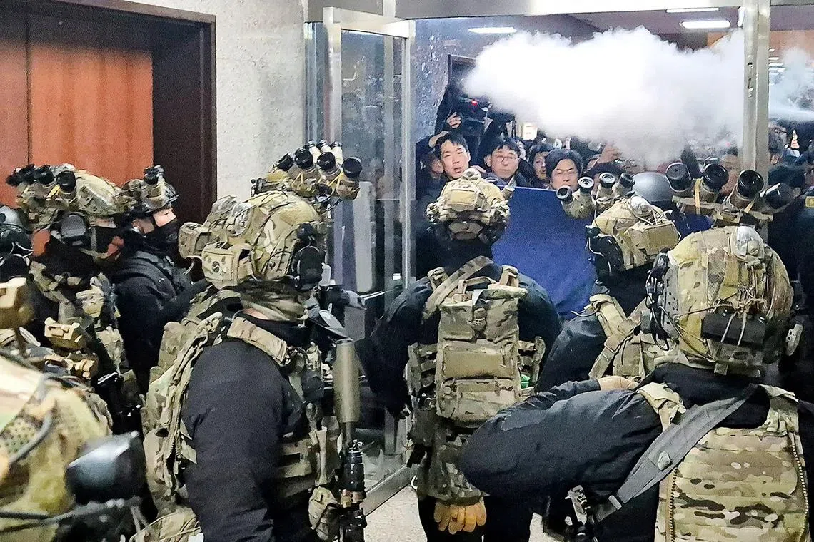 Soldiers trying to enter the main hall of the National Assembly on Dec 3, 2024, after South Korea President Yoon Suk Yeol declared martial law. 