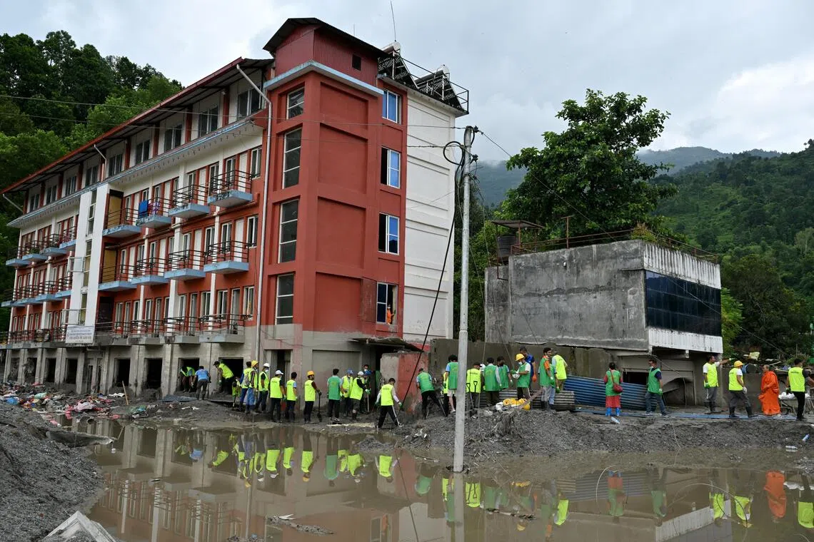 Dozens showed up for disaster response non-profit Mission Rebuild Nepal’s call for volunteers to help remove silt from salvageable buildings in Devighat.