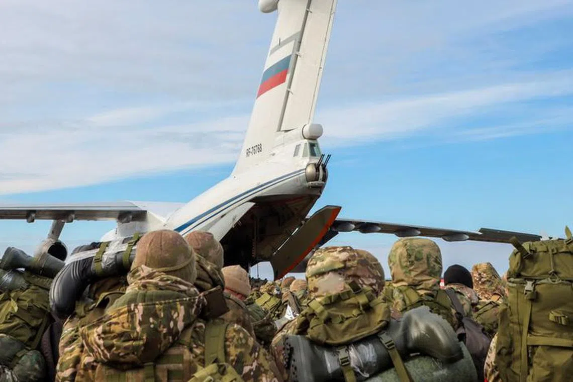 Volunteers, who joined the Russian armed forces and took military training in Chechnya, board a plane before departing for positions of the Akhmat battalion involved in Russia's military campaign in Ukraine, at an airport in Grozny, Russia, January 17, 2024. REUTERS/Chingis Kondarov/File Photo