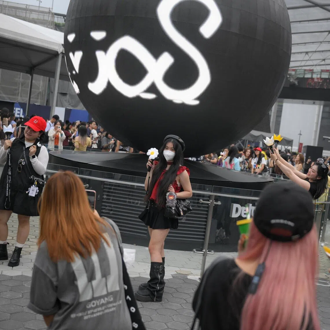 Concertgoers outside Stadium MRT station ahead of BigBang’s XX: Cosmos world tour on Oct 17.