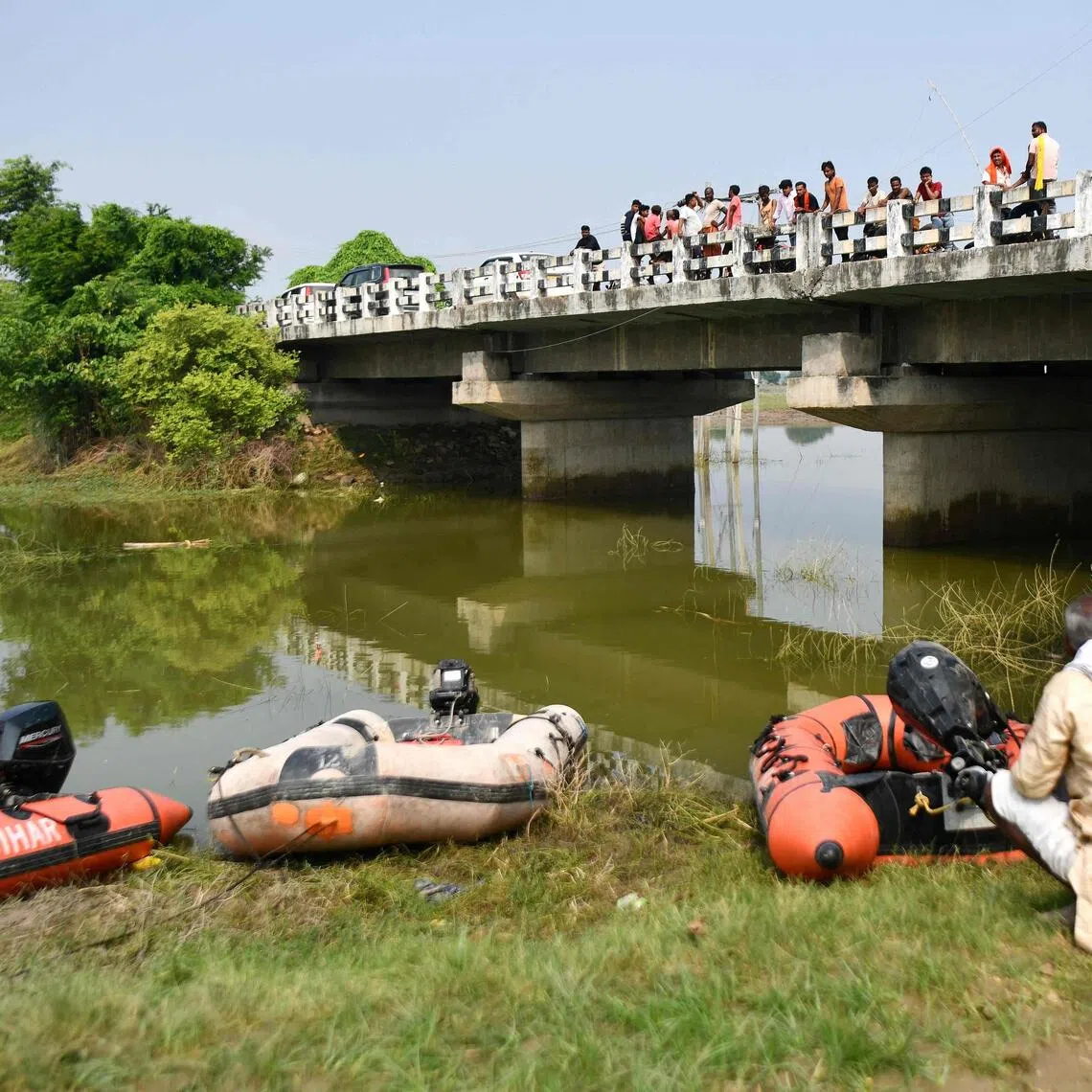Rescue personnel conducting a search operation for the missing after a boat capsized in Ganga river in Vaishali district, in India’s Bihar state, on Oct 14.