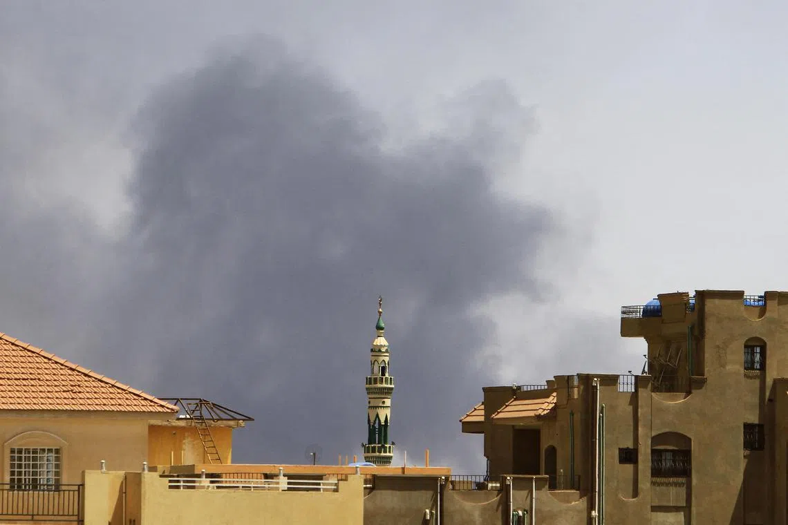 Smoke billows in southern Khartoum amid ongoing fighting between the forces of two rival generals in Sudan.