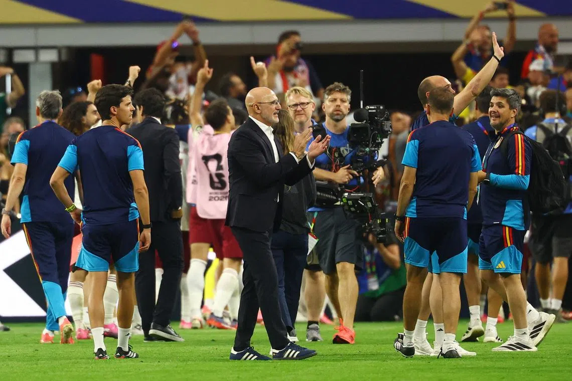 Soccer Football - FIFA World Cup 2026 - Semi Final - France v Spain - Dallas Stadium, Arlington, Texas, U.S. - July 14, 2026 Spain coach Luis De La Fuente celebrates after the match REUTERS/Kai Pfaffenbach
