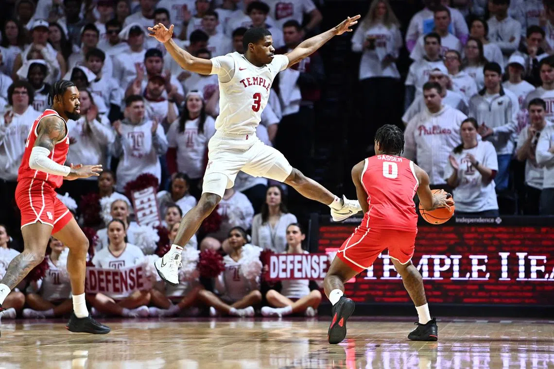 FILE PHOTO: Feb 5, 2023; Philadelphia, Pennsylvania, USA; Temple Owls guard Hysier Miller (3) jumps to defend Houston Cougars guard Marcus Sasser (0) in the second half at The Liacouras Center. Mandatory Credit: Kyle Ross-USA TODAY Sports/File Photo