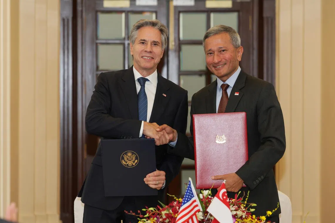 Foreign Minister Vivian Balakrishnan (right) and US Secretary of State Antony Blinken shaking hands after the signing of the 123 Agreement on July 31.