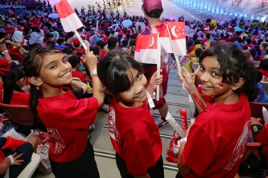 (From right) P5 Hougang Primary School pupils Fahirah Mohammed Shajahan, Amber Zarafyna Abdul Hakim, Yasmin Nadhirah Muhammad Ishaq at the National Education Show 1 at the National Stadium on July 11.