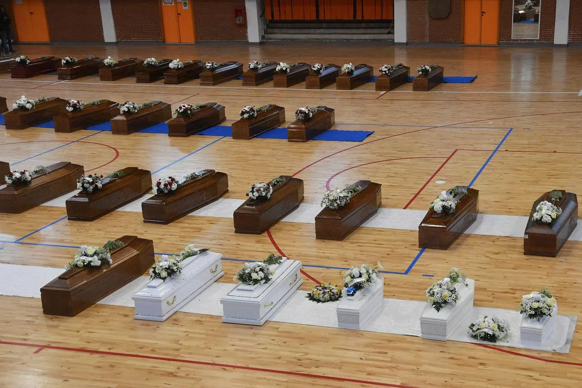 The coffins of migrants who died on Sunday after their boat sank off Italy's southern Calabria region.