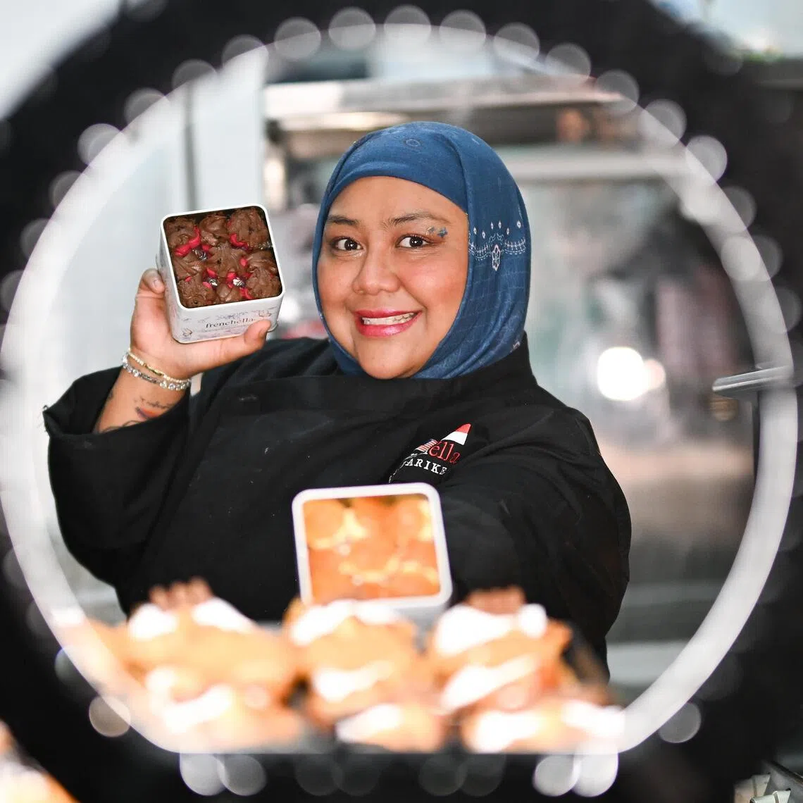 Ms Nur Syafawani, 30, is a mother of three young kids aged 12, 9 and 3, and small bakery business owner.