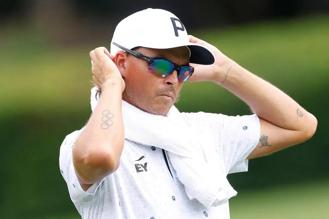 Rickie Fowler of the United States looks over his putt on the second tee prior to the Wyndham Championship.
