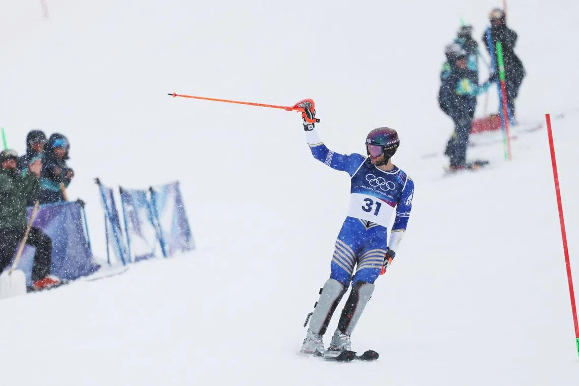 Milano Cortina 2026 Olympics - Alpine Skiing - Men's Slalom Run 1 - Stelvio Ski Centre, Bormio, Italy - February 16, 2026. Aj Ginnis of Greece reacts at the end of his first run in the Men's Slalom REUTERS/Gintare Karpaviciute
