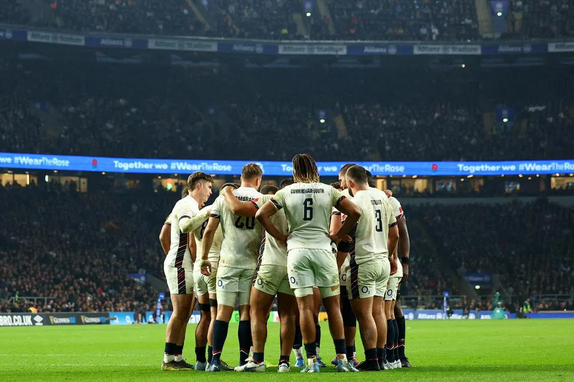 England players huddling during the rugby union international against Australia at Twickenham on Nov 9, 2024.