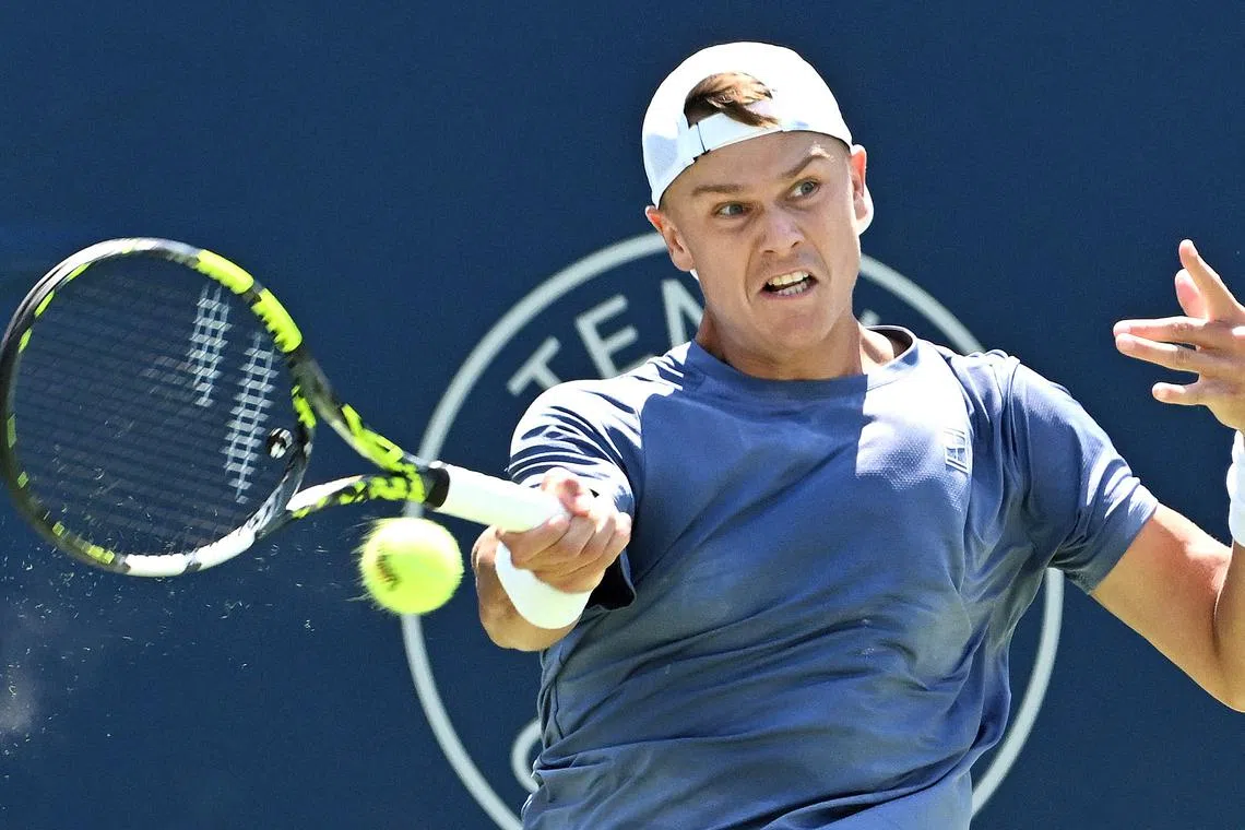 FILE PHOTO: Jul 29, 2025; Toronto, ON, Canada;  Holger Rune (DEN) plays a shot against Giovanni Mpetshi Perricard (FRA) during second round play at Sobeys Stadium. Mandatory Credit: Dan Hamilton-Imagn Images/File Photo