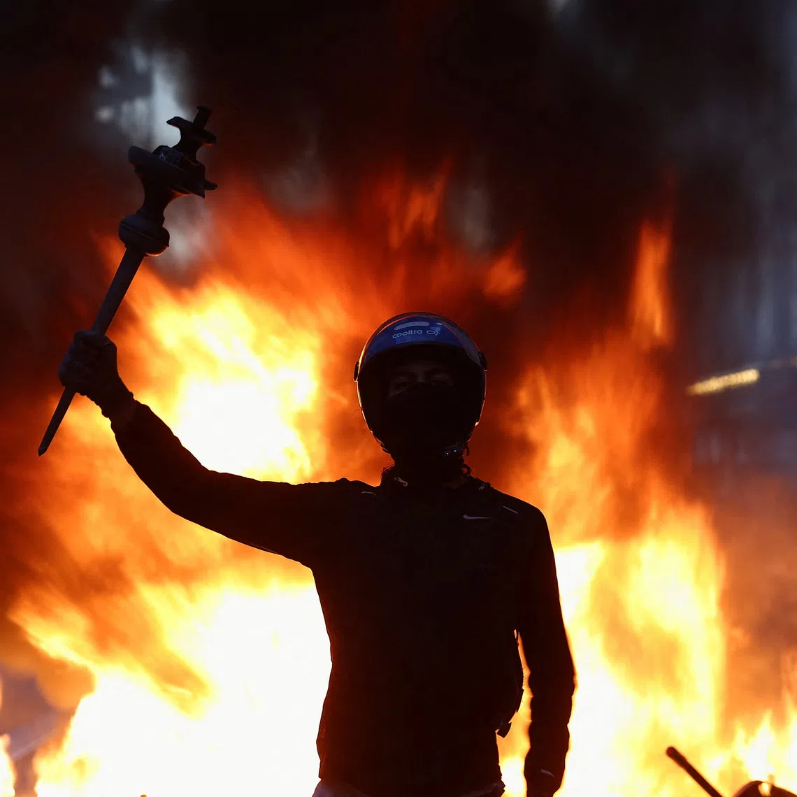 Clad in all black and with faces covered, ultra-left agitators are blamed by officials of transforming peaceful protests into widespread looting.