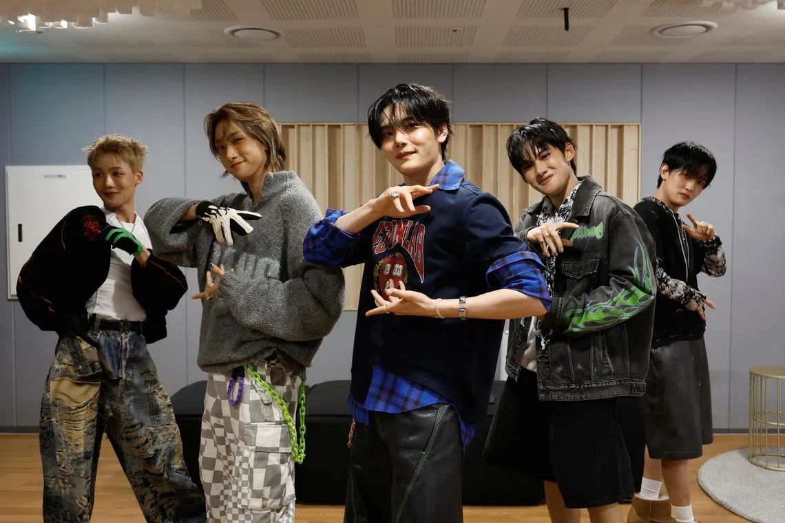 Members of K-pop boy band 1VERSE, including Hyuk and Seok who defected from North Korea, as well as Aito, Nathan and Kenny, perform their new single in front of a camera in Seoul, South Korea, May 21, 2025. REUTERS/Kim Soo-hyeon