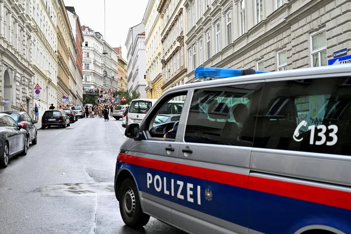 FILE PHOTO: A police vehicle patrols as fans of the singer Taylor Swift gather following the cancellation of three Taylor Swift concerts at Happel stadium after the government confirmed a planned attack at the venue, in Vienna, Austria August 8, 2024. REUTERS/Elisabeth Mandl/File Photo
