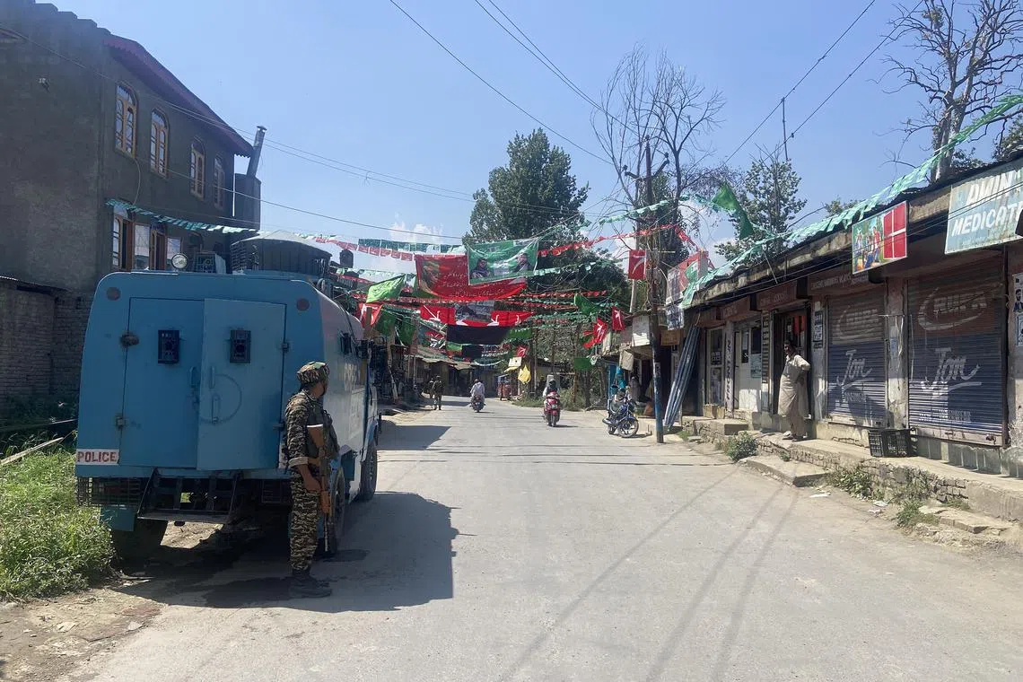 Flags of different political parties flutter in the wind in Pulwama in Kashmir.