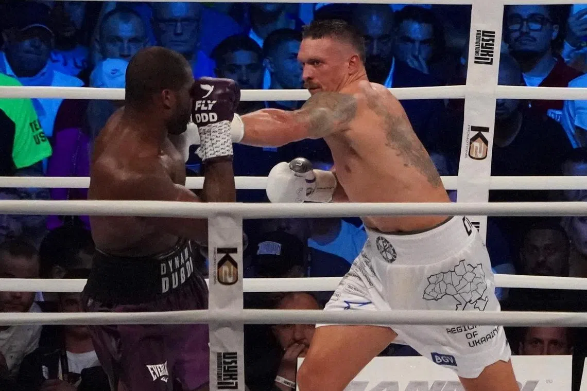 Ukraine’s reigning world heavyweight champion Oleksandr Usyk (right) fighting challenger Daniel Dubois of Great Britain at Tarczynski Arena in Wroclaw, Poland on Aug 26. Usyk retained his world heavyweight titles with a ninth-round knockout of Dubois.
