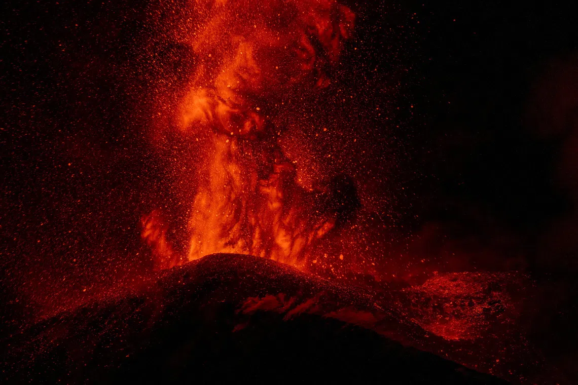 Lava is ejected from a crater during an eruption of Mount Etna, in Sicily, Italy, on Aug 13.