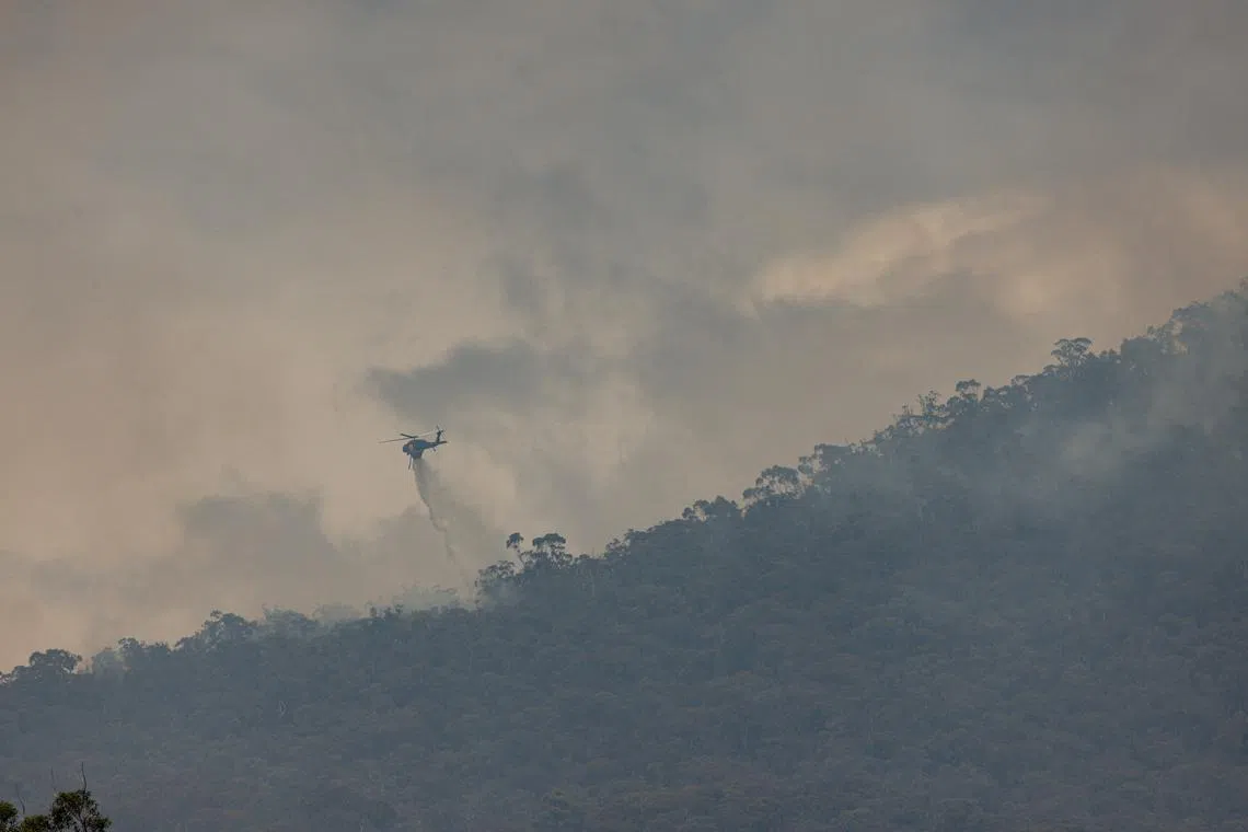 Fire crew battles bushfires at Halls Gap in the Grampians region of Victoria in Melbourne, Australia, on Dec 27, 2024.