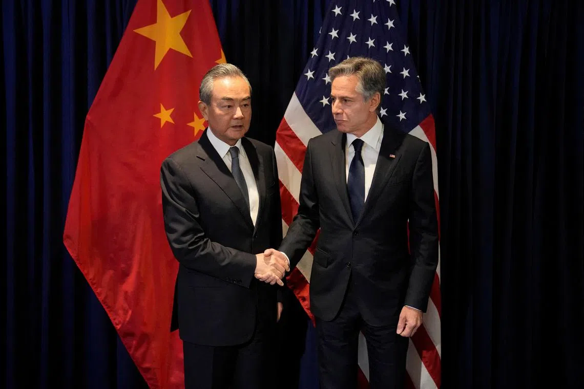 US Secretary of State Antony Blinken shakes hands with China's top diplomat Wang Yi at the Asean meeting in Jakarta.